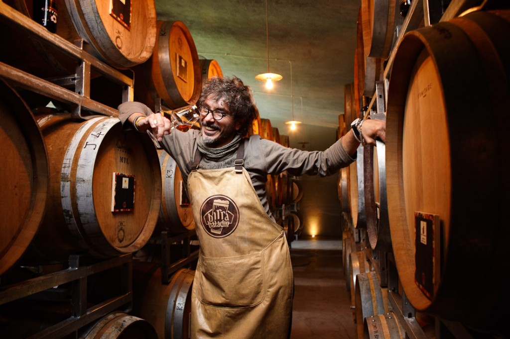 Two Musso, who runs the Baladin brewery in Piozzo, Italy, samples beers being aged in old wine casks.